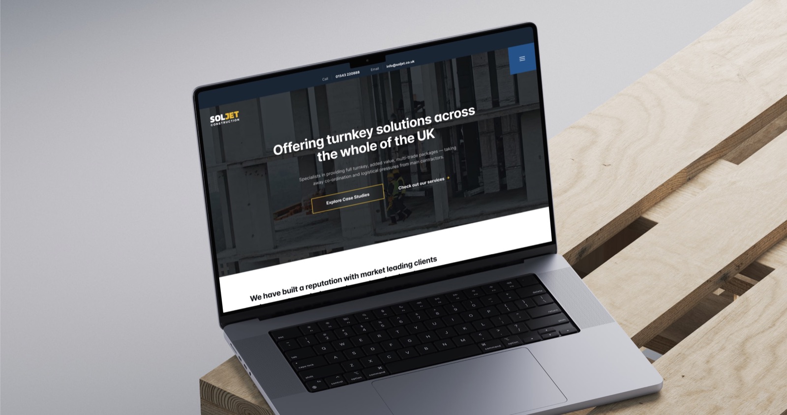 The SOLJET construction website on a laptop