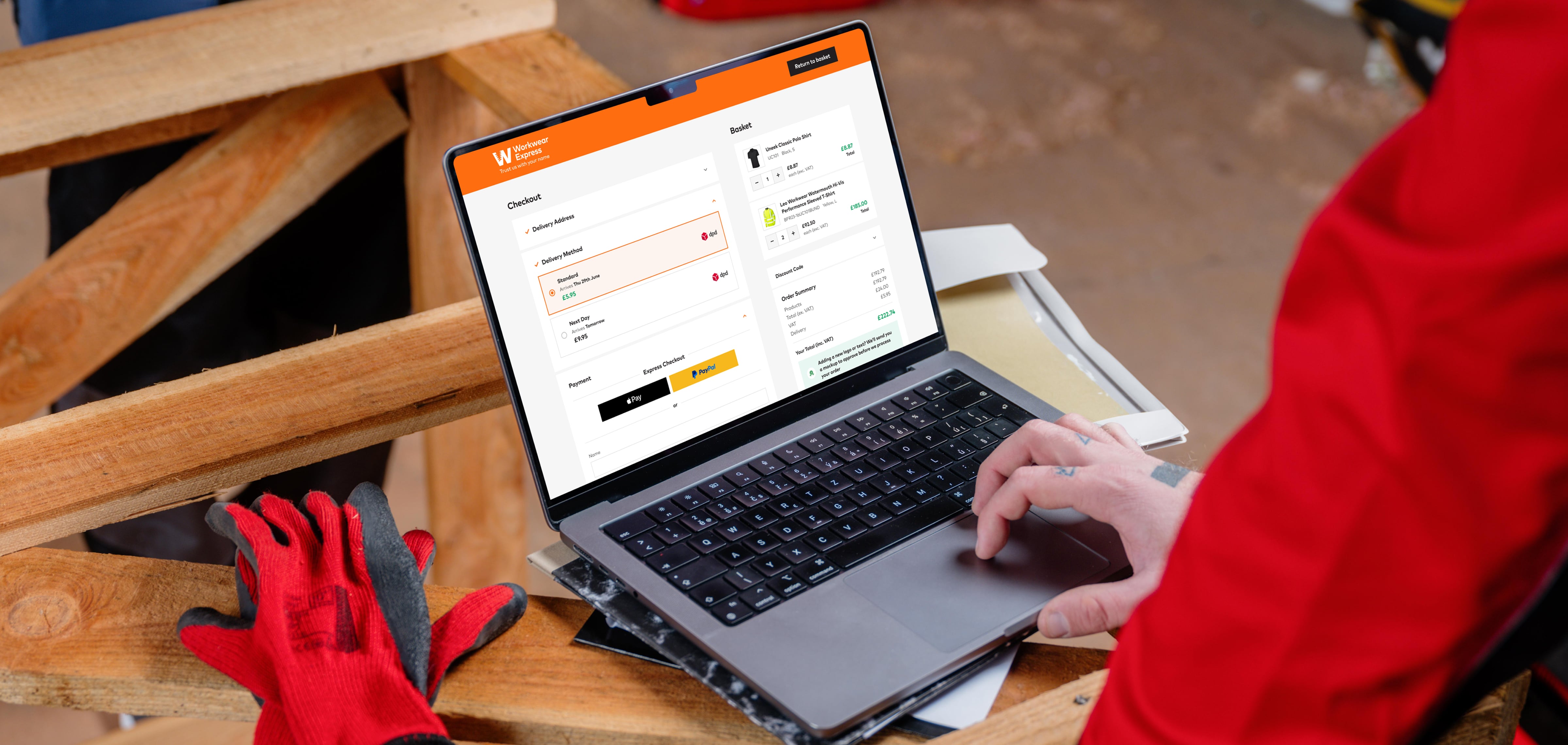 Workwear Express ecommerce checkout on a laptop on a workshop bench